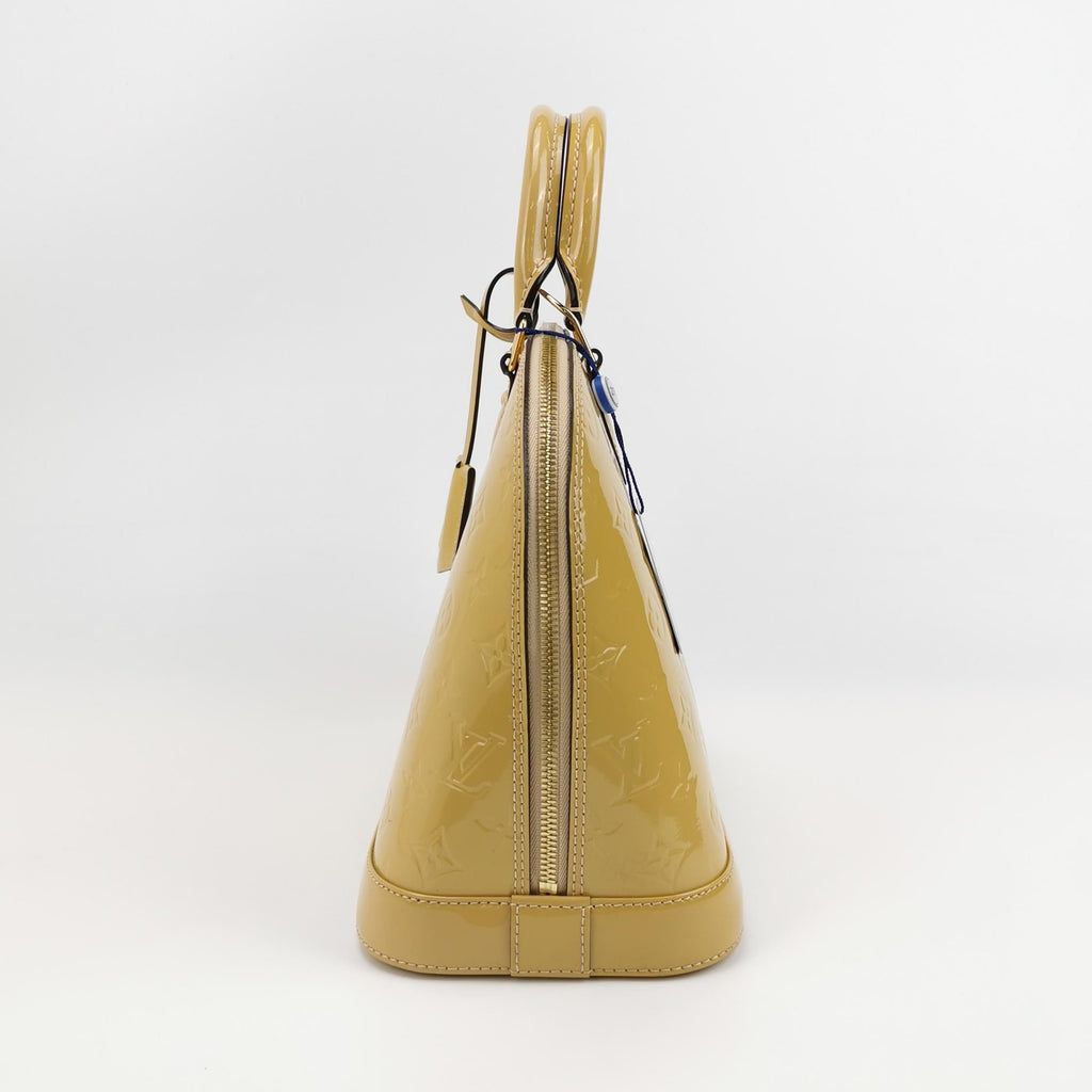 Sac Alma PM vintage en cuir verni beige Louis Vuitton