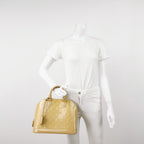 Sac Alma PM vintage en cuir verni beige Louis Vuitton